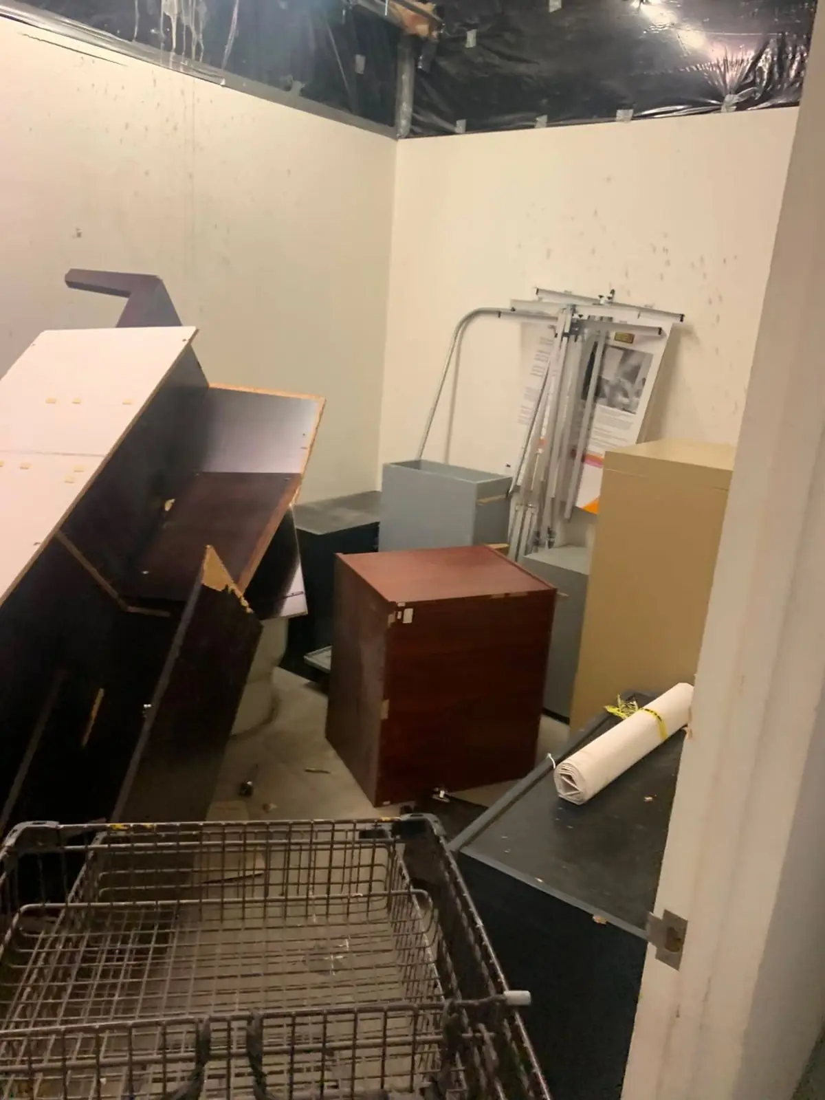 Storage Room Cleanout - Furniture and office items removed from a cluttered storage room.